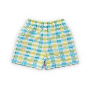 Flatlay of yellow and blue checked shorts with elastic waistline and side pockets