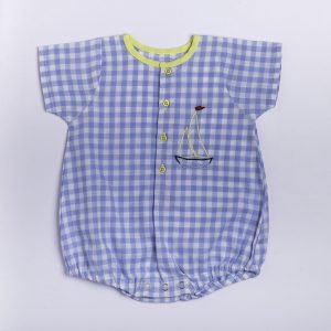 Flatlay of blue gingham hand embroidered onesie with a bright yellow neckline trim