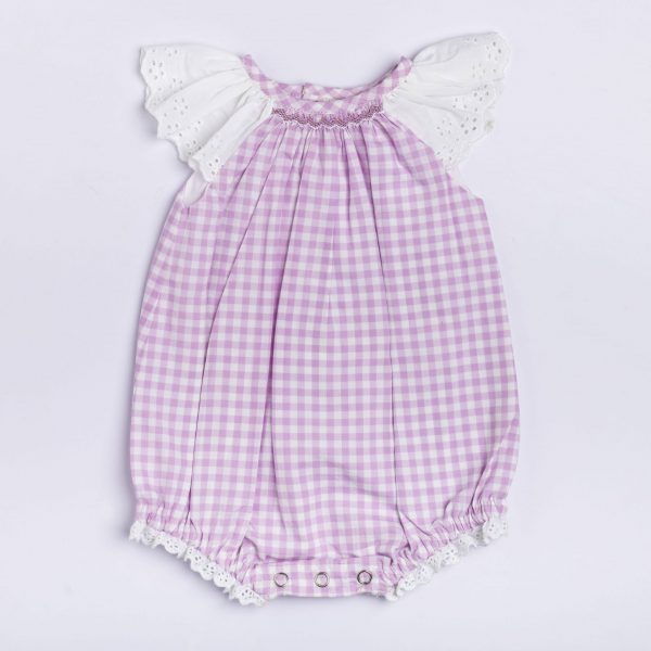 Lavender onesie with a beautiful hand smocked neckline and lace flutter sleeves