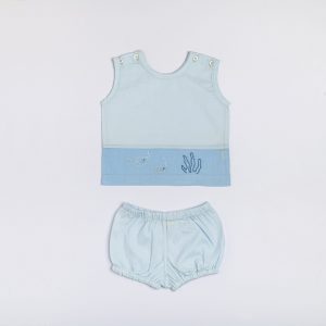 Flatlay of blue dual-tone hand embroidered baby vest and diaper cover set