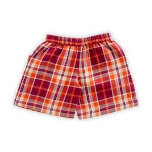 Flatlay of orange plaid shorts with slant pockets with triangular flaps fastened with wood buttons
