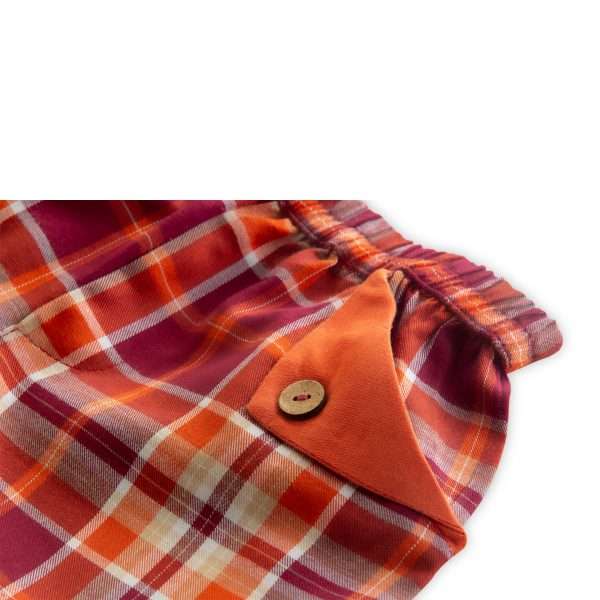 Close up of orange checked shorts with flap pocket