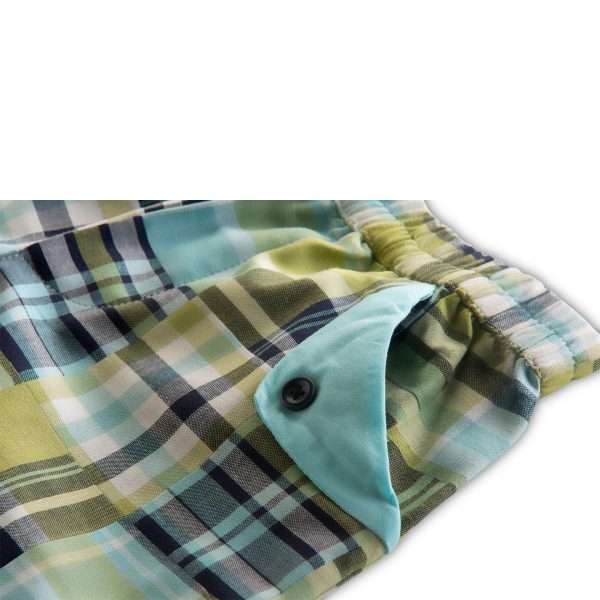 Close up of green checked shorts with flap pockets and elasticated waistband