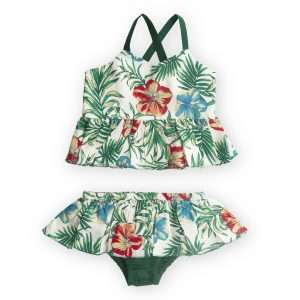 Flatlay of tropical print baby swimwear set with ruffle details on the bottom and strappy top