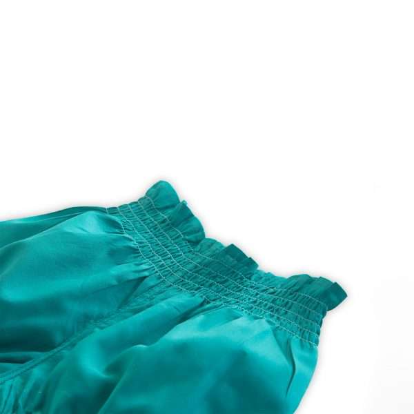 Close up of teal diaper cover with cinched waistline