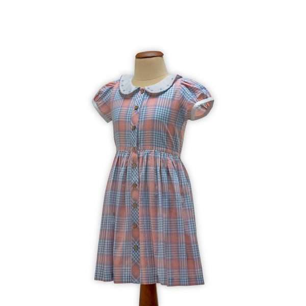 Mannequin image of plaid checked dress with puff sleeves with hand embroidered flowers on collar