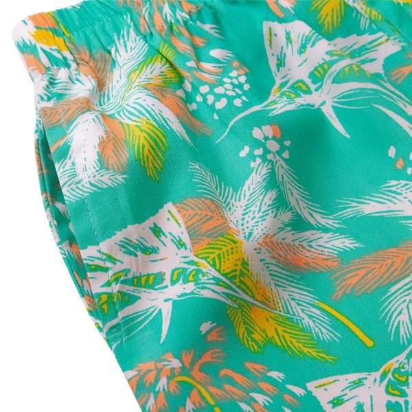 Close-up of tropical palm tree printed capri pants for girls