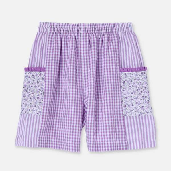 Girls long shorts ina patchwork of floral, gingham and lavender dots wirh elasticated waist an pockets