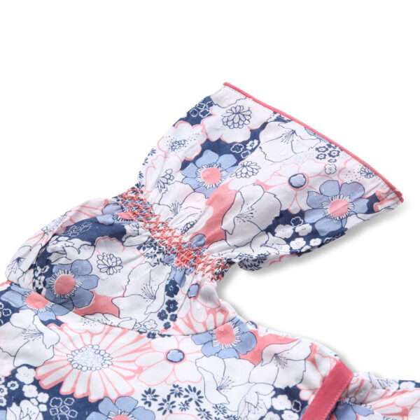 Close-up of swiss dot pink and blue floral printed cotton dress with bell sleeves