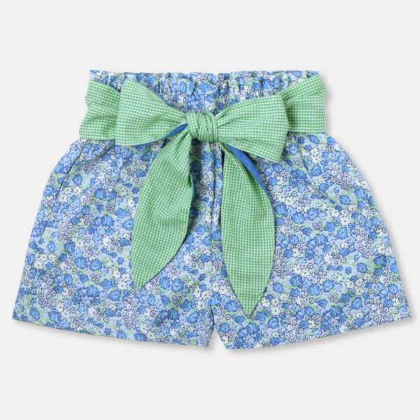 Blue printed paperbag girls shorts with a wide green gingham belt tied into a bow