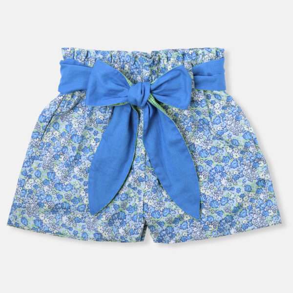 Blue floral print shorts with a bright blue belt tied into a bow.