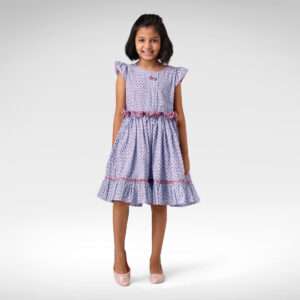 A little girl in blue and red round neck printed dress with ruffle belt and bow detail on neckline