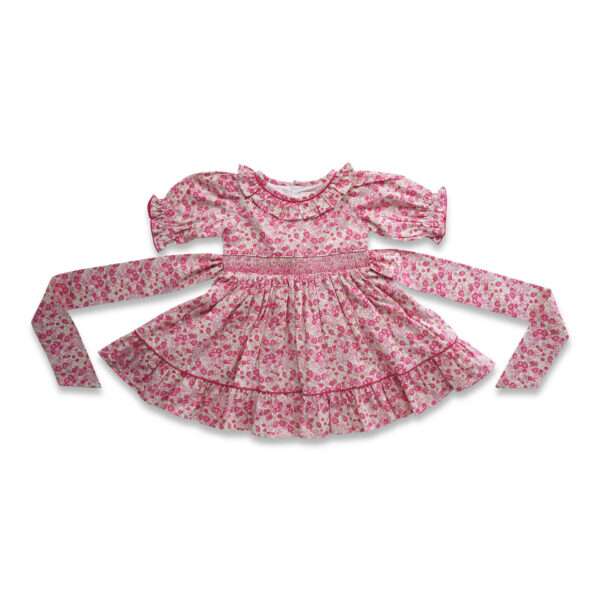 Pink floral embroidered cotton dress with a hand smocked waistline, ruffled collar and tie-up straps