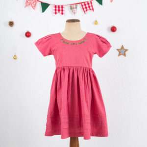 Mannequin shot of pink cotton dress with hand smocked waistline and hand embroidered details on neckline