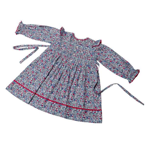 Full sleeve pleated dress with hand embroidered button and pink ric rac trim