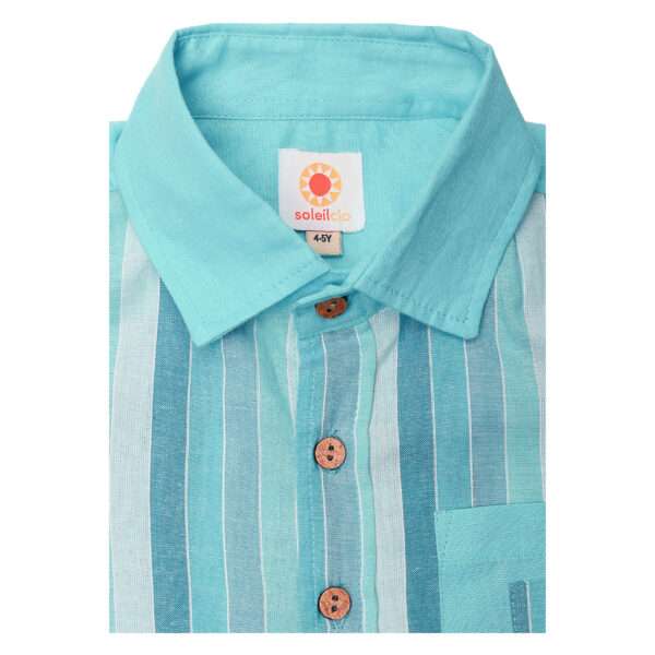 Close up of turquoise blue chambray half sleeve cotton shirt with stripes in shades of blue and a spacious chest pocket