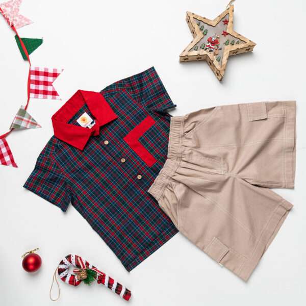 Soleilclo boys shirt in green plaid with matched khaki shorts pictured with Christmas decorations
