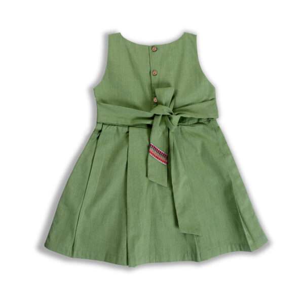 Back ties on a girls green fit and flare dress
