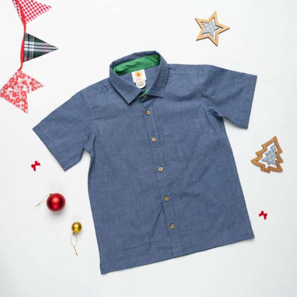 Flatlay of navy filafil shirt with wooden buttons