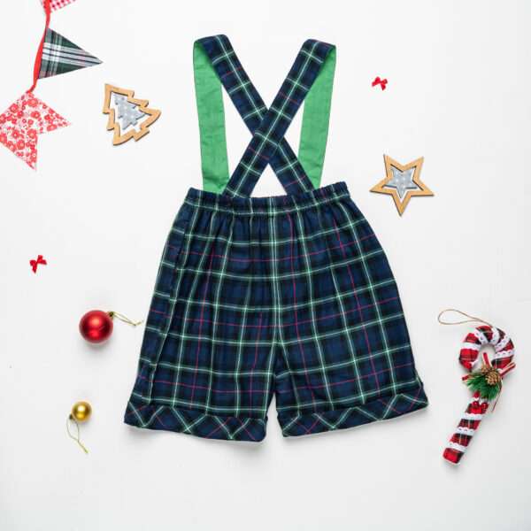 Boys shorts with suspenders in navy plaid pictured with Christmas decorations