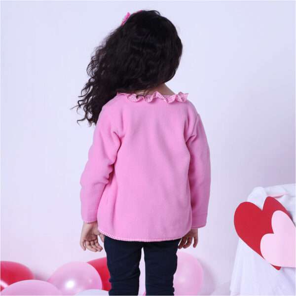 Rear image of a girl in fleece jacket lined in soft pink cotton, with pink gingham edging and a neckline ruffle