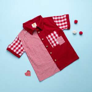 Flatlay of red checked shirt made from a patchwork of big and micro red gingham and solid red voile