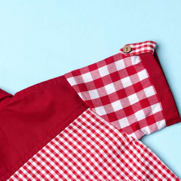 Close-up of red checks shirt made from a patchwork of big and micro red gingham and solid red voile