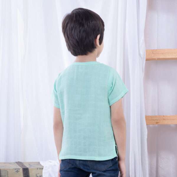 Rear image of a boy in aqua gauze boy's shirt