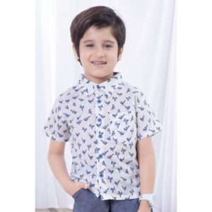 A boy posing in soft cotton bird printed collared shirt with contrast blue buttons