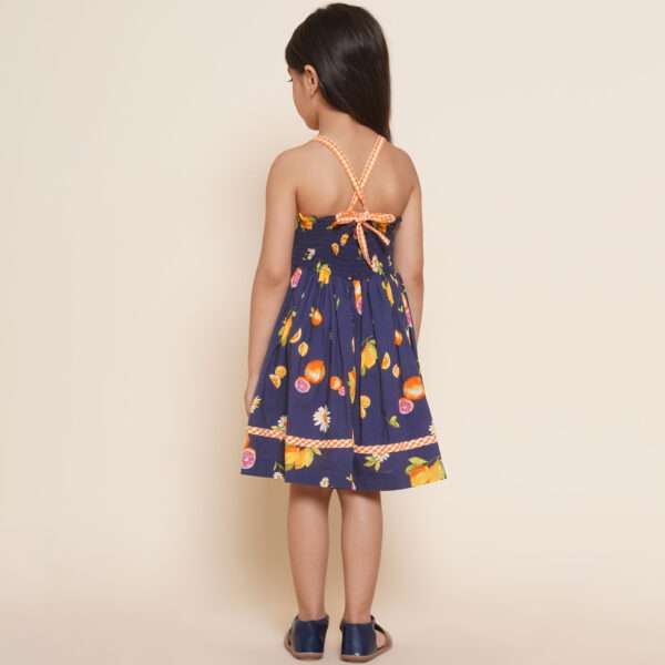 Size chart of strappy shoulder floral and fruit printed navy dress with contrast trims