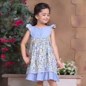 A little girl in blue chambray floral printed cotton dress with flutter sleeves, eyelet lace trims and ruffled hem