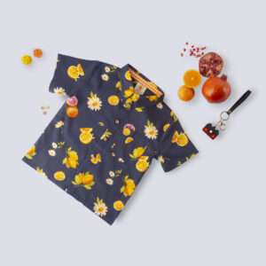 Flatlay of navy fruit printed shirt featuring a classic collar, convenient pocket on the chest, and button-down front