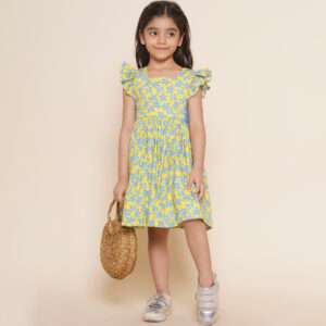 A cheeky girl in yellow floral printed dress with faux crochet lace side panels and tie-up back ribbon
