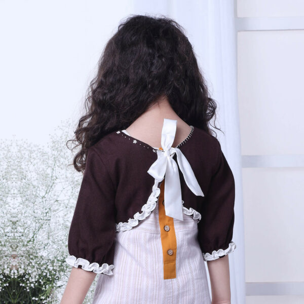 Back view of an embroidered brown bolero jacket with tie up satin sash
