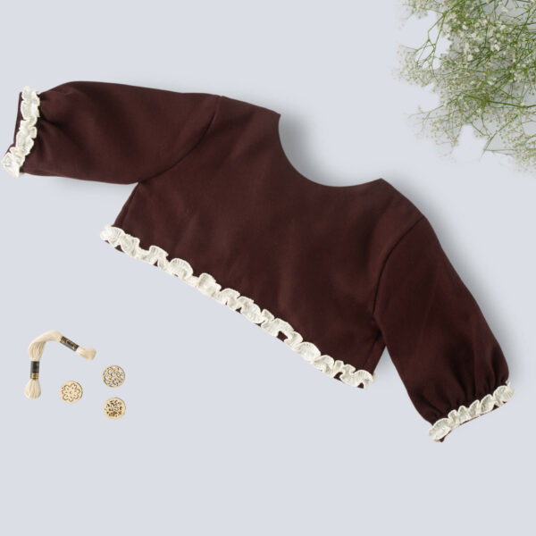 Flat lay view of a brown bolero embroidered girls jacket with lace details