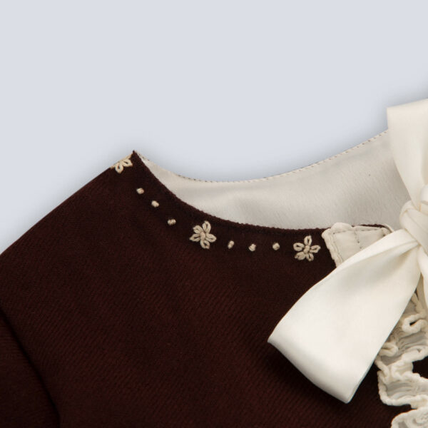 Flat lay view of a brown bolero embroidered jacket for girls featuring a tie-up sash bow