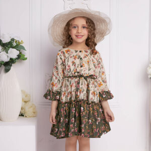 Hat-topped, a child wears ruffle dress in contrast tones