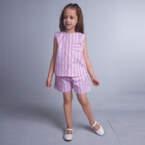 Young girl in pink and white striped co-ords sets