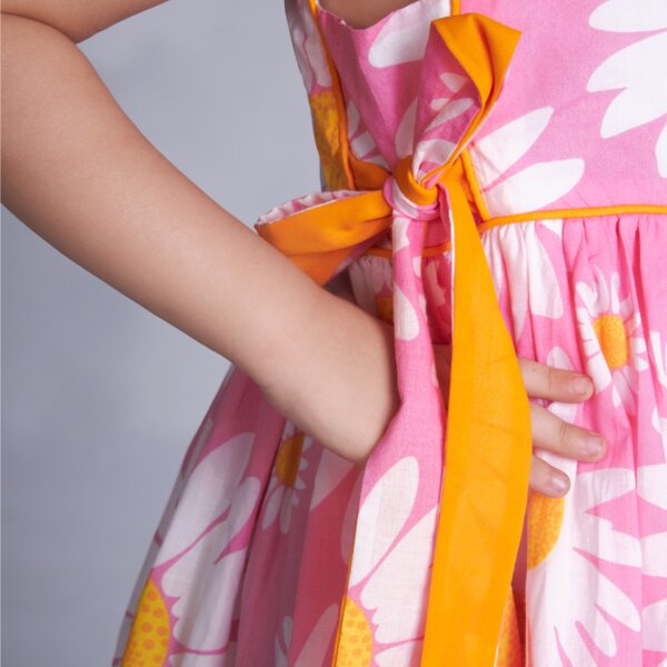 Close up of the contrast side ties of pink floral printed dress