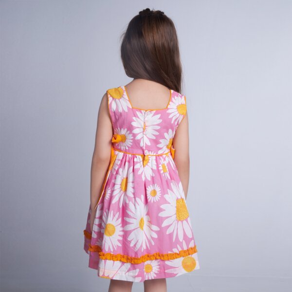 Back view of pink floral side ties in contrasting tones, fastened at the back with buttons