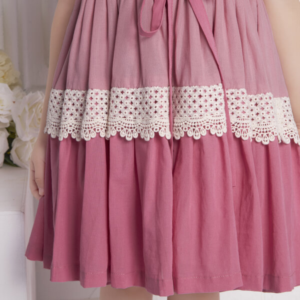 Detailed close-up of the pink ombre embroidered dress skirt