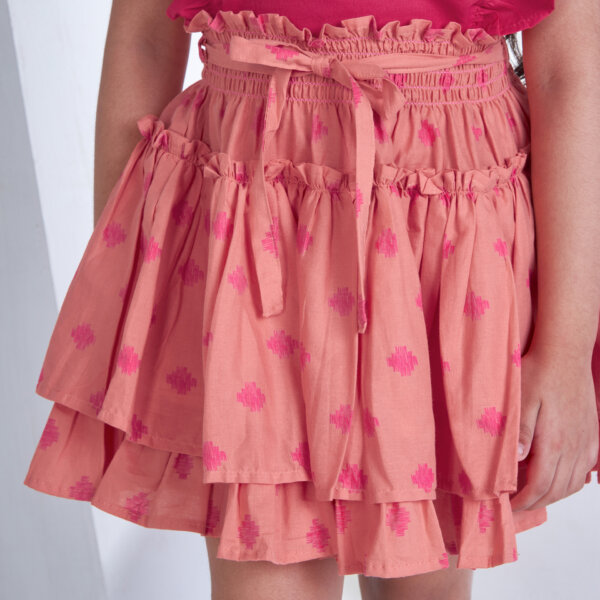 Close up shot of peach floral printed high waist skirt