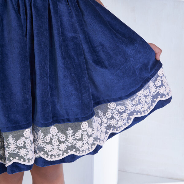 Closeup detail of lace in the navy velvet dress